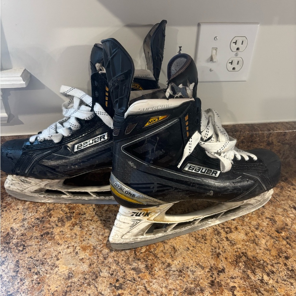 Bauer Supreme MX3 Skates in Black and White with Gold Accents